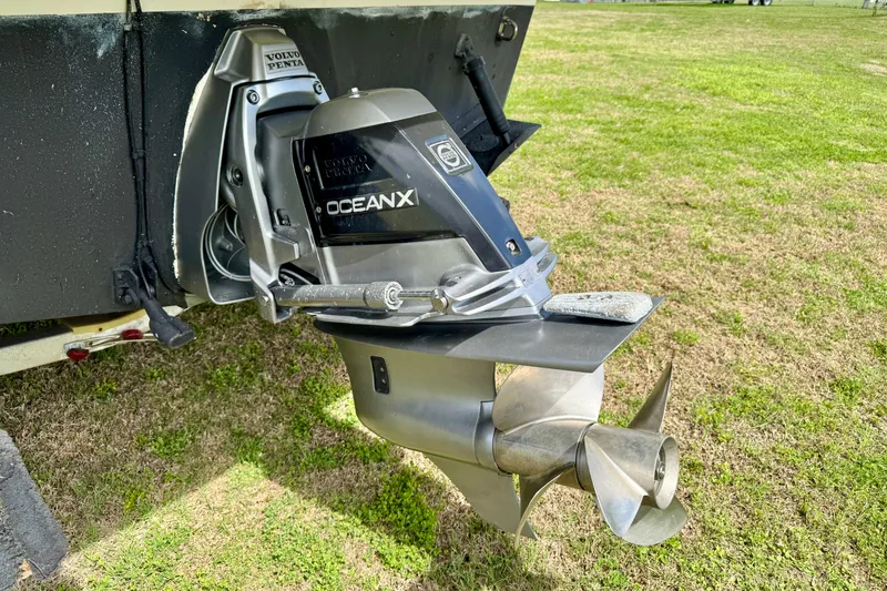 Slide: The Image of Volvo Penta OceanX drive on 2007 Larson Cabrio 274 boat, displayed on grass. - 28