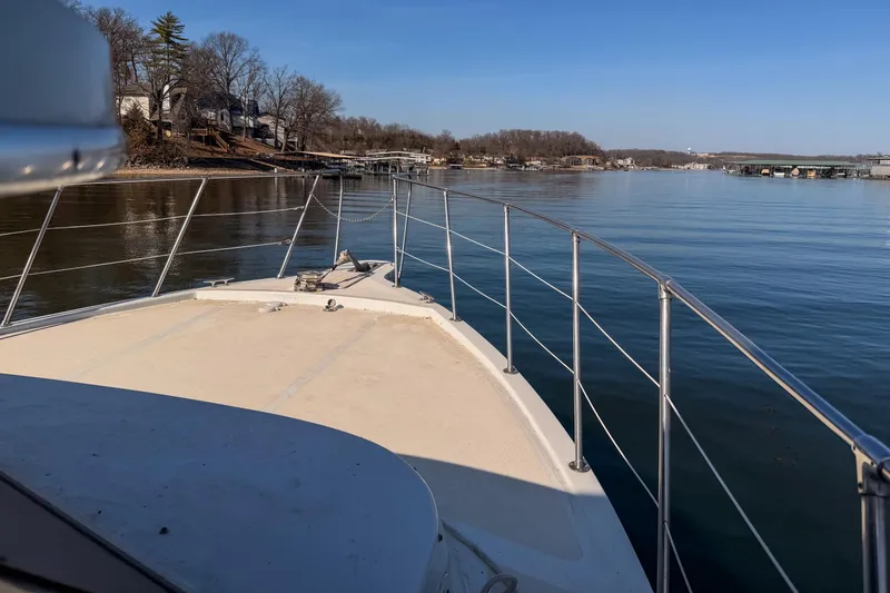 Slide: The Image of Bow view of 1985 Blue Water 51 Coastal yacht on a calm lake. - 12