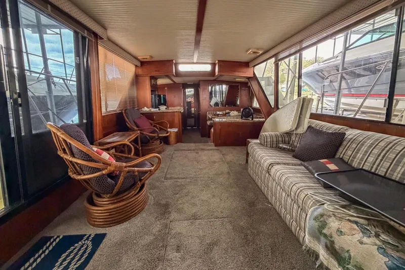 Slide: The Image of Interior of 1984 Blue Water 51 Coastal yacht with cozy seating and large windows. - 20