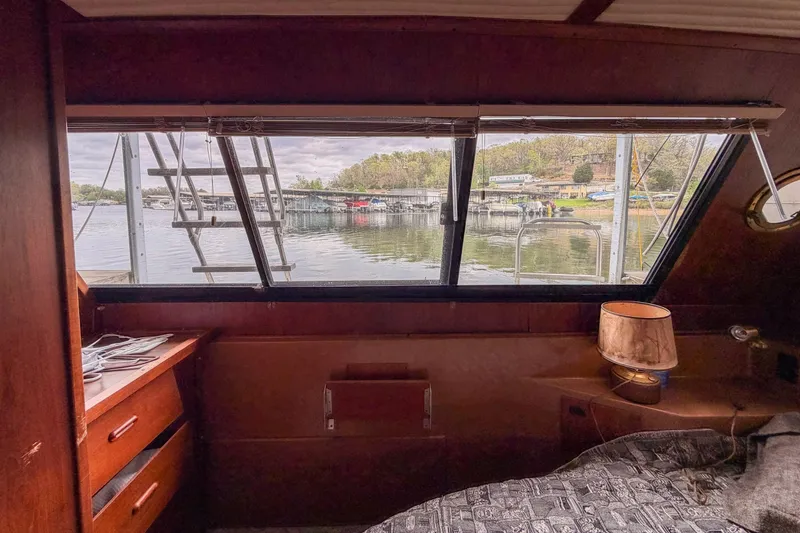 Slide: The Image of Interior view of 1984 Blue Water 51 Coastal yacht with lake scenery through window. - 32