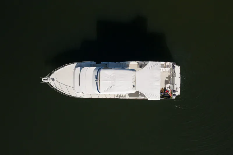 Slide: The Image of Aerial view of 1985 Blue Water 51 Coastal yacht on calm water. - 6