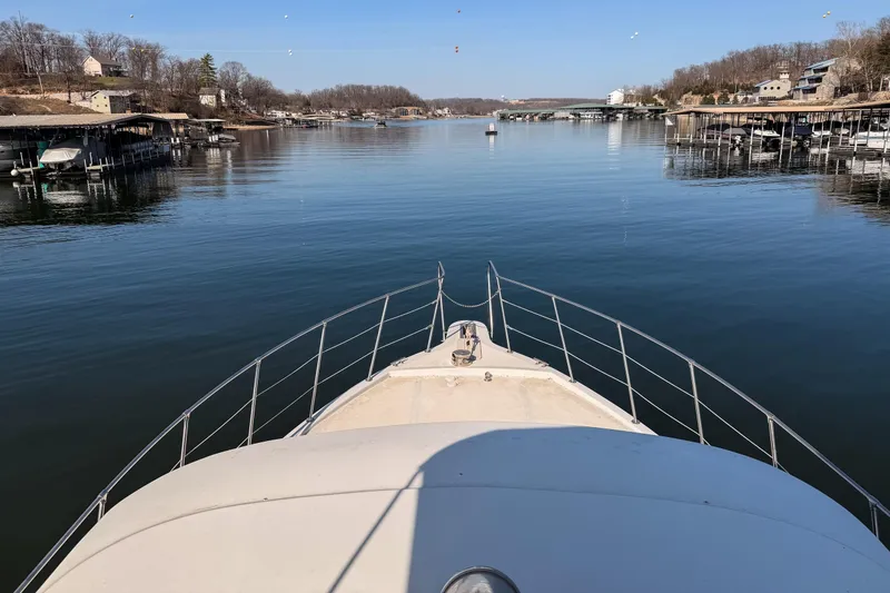 Slide: The Image of Bow view of 1985 Blue Water 51 Coastal yacht on a serene lake. - 7