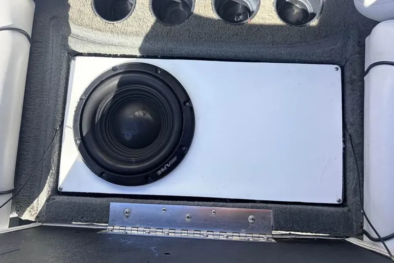 Slide: The Image of Subwoofer installed in a 2005 Nautique Super Air Nautique 210 boat interior. - 4