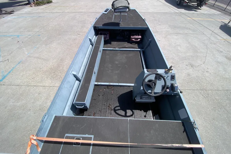 Slide: The Image of 2009 Pro-Drive X Series 17' boat interior with steering console and seating. - 11