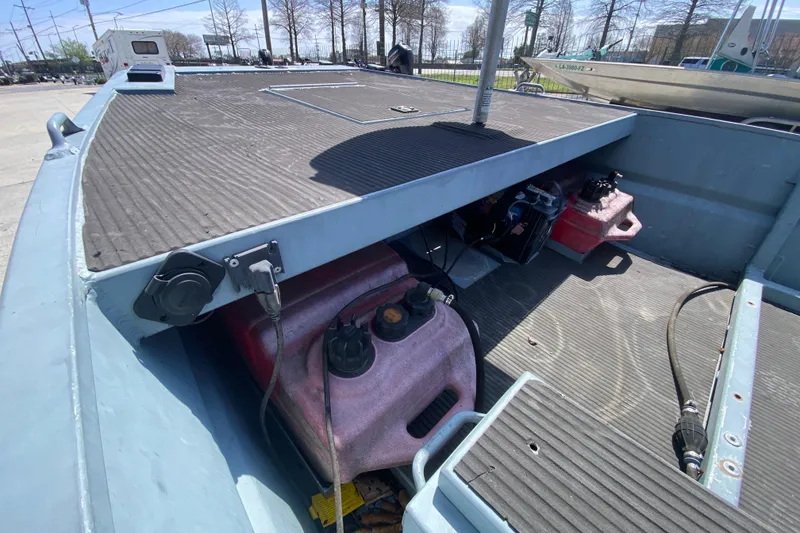 Slide: The Image of 2009 Pro-Drive X Series 17' boat interior with fuel tank and storage area. - 17