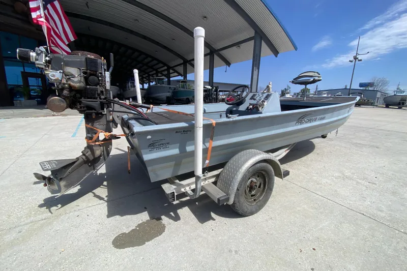 Slide: The Image of 2009 Pro-Drive X Series 17' boat on trailer, outdoor dealership setting. - 3