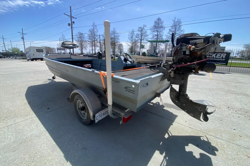 Slide: The Image of 2009 Pro-Drive X Series 17' boat on trailer, parked outdoors. - 5