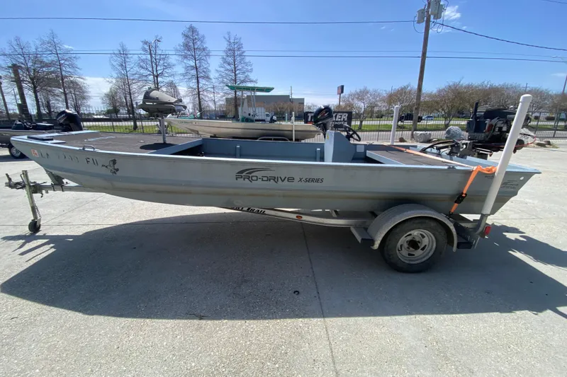 Slide: The Image of 2009 Pro-Drive X Series 17' boat on trailer, parked outdoors. - 6