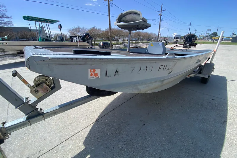 Slide: The Image of 2009 Pro-Drive X Series 17' boat on trailer, parked outdoors. - 7