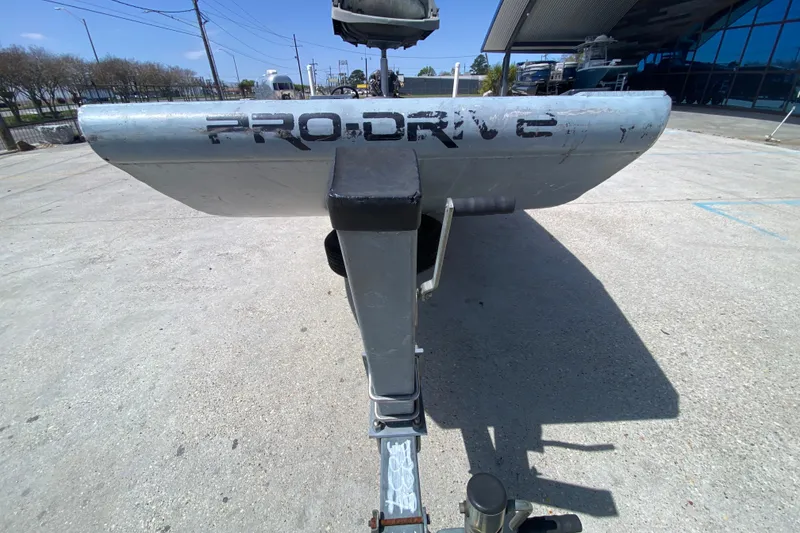 Slide: The Image of Rear view of a 2009 Pro-Drive X Series 17' boat on a trailer. - 8