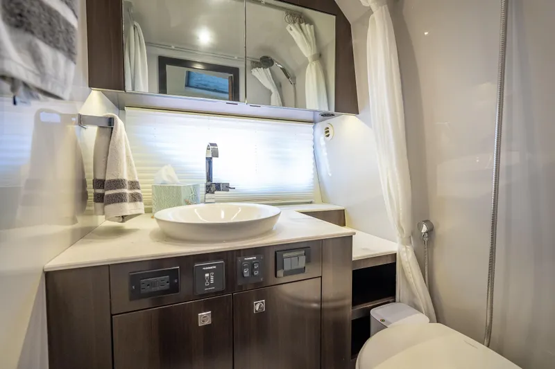Slide: The Image of Luxurious bathroom interior of 2022 Cruisers Yachts 38 GLS OB with modern fixtures. - 36