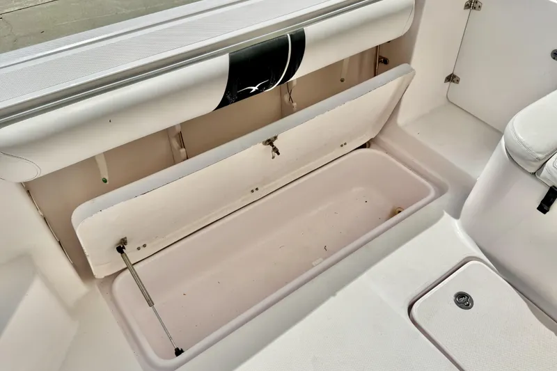 Slide: The Image of Open storage compartment on a 2005 Pro-Line 29 Walkaround boat interior. - 19