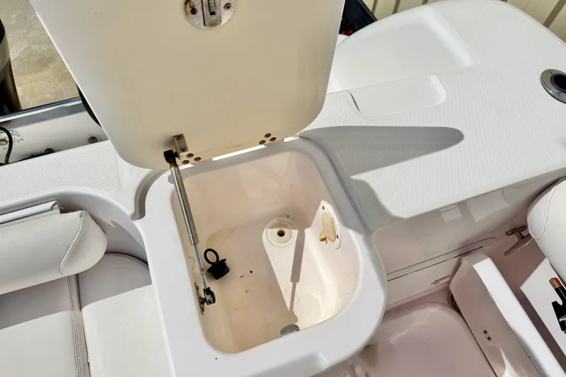Slide: The Image of Open storage compartment on a 2005 Pro-Line 29 Walkaround boat. - 21