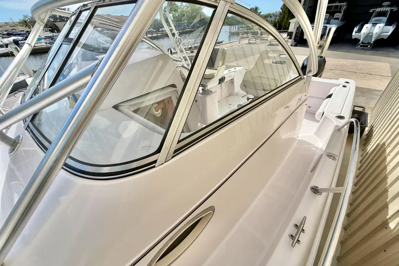 Slide: The Image of 2005 Pro-Line 29 Walkaround boat with sleek design and spacious deck. - 26
