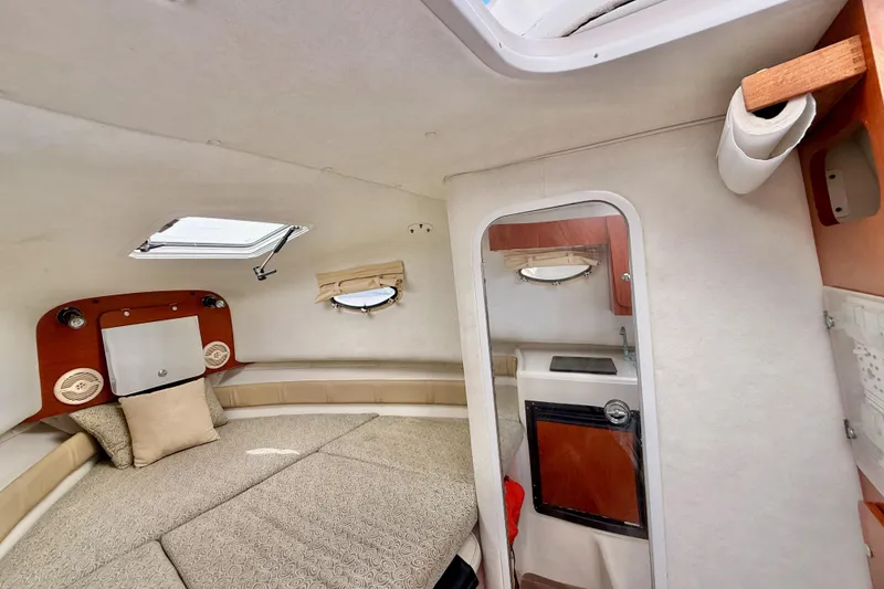 Slide: The Image of Interior of 2005 Pro-Line 29 Walkaround boat with cozy cabin and compact kitchenette. - 31