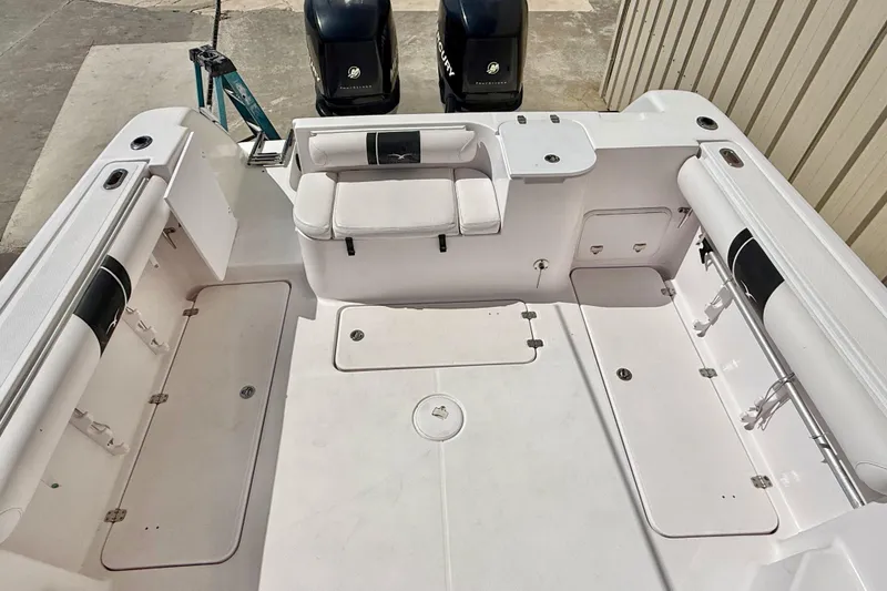 Slide: The Image of 2005 Pro-Line 29 Walkaround boat interior with seating and storage compartments. - 7