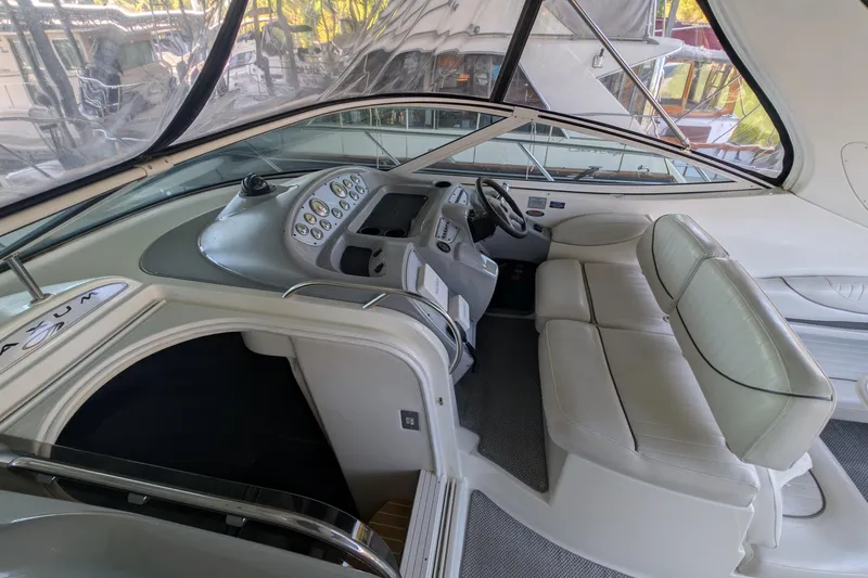 Slide: The Image of Interior of 2004 Maxum 3700 SY yacht with sleek dashboard and comfortable seating. - 10