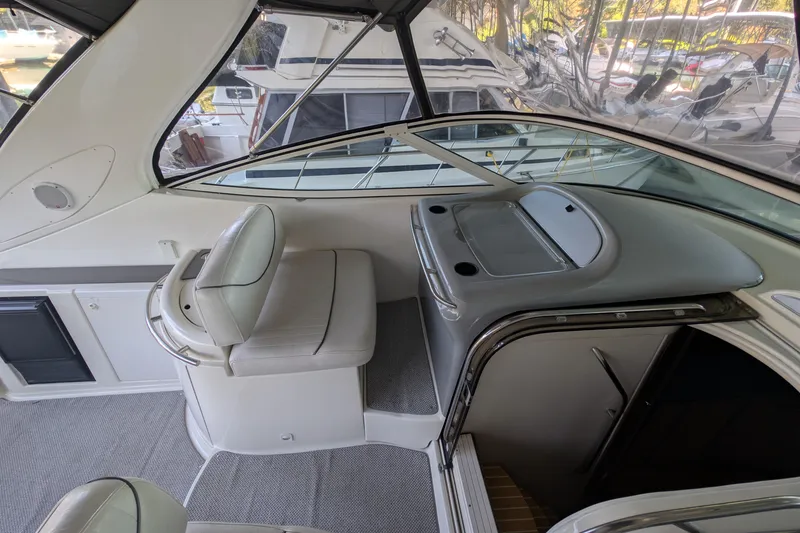 Slide: The Image of Interior of 2004 Maxum 3700 SY yacht with helm seat and dashboard. - 11