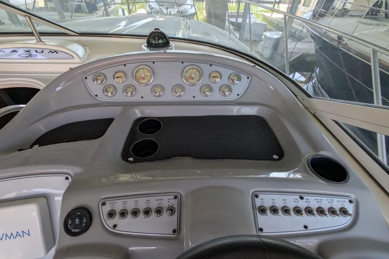 Slide: The Image of Dashboard of a 2004 Maxum 3700 SY boat with gauges and controls. - 12