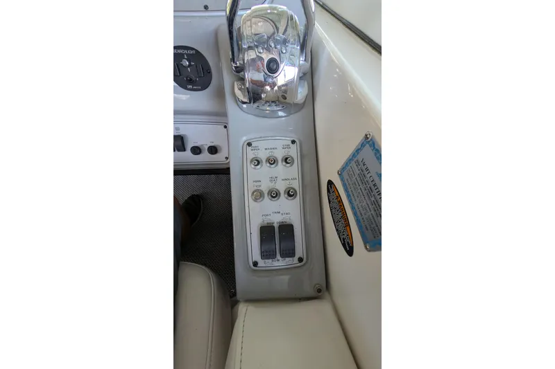 Slide: The Image of Control panel of a 2004 Maxum 3700 SY boat with switches and labels. - 14
