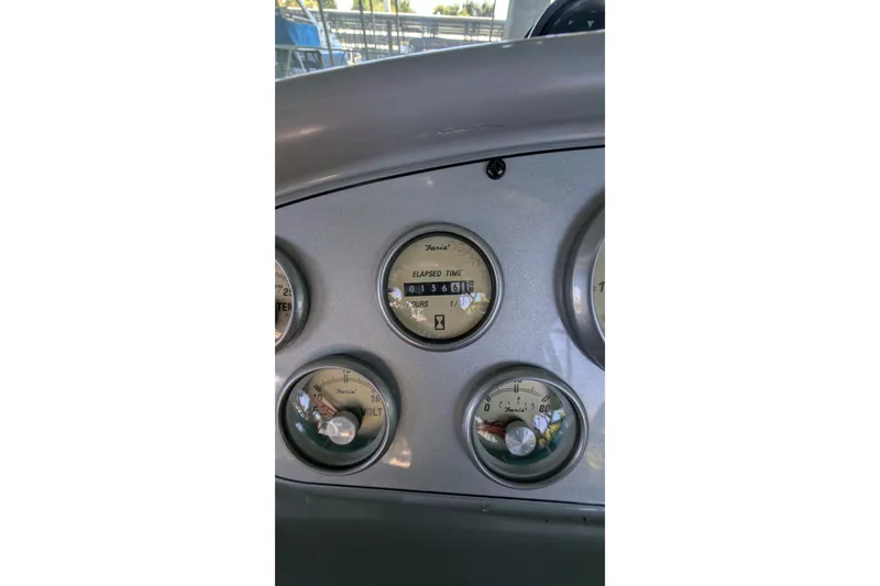 Slide: The Image of Dashboard gauges of a 2004 Maxum 3700 SY boat, displaying elapsed time and voltage. - 16
