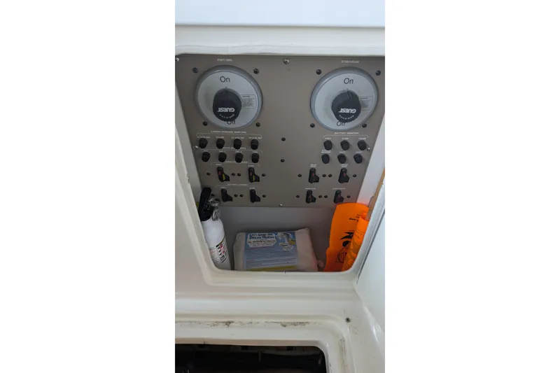 Slide: The Image of Control panel of a 2004 Maxum 3700 SY boat with switches and safety equipment. - 18
