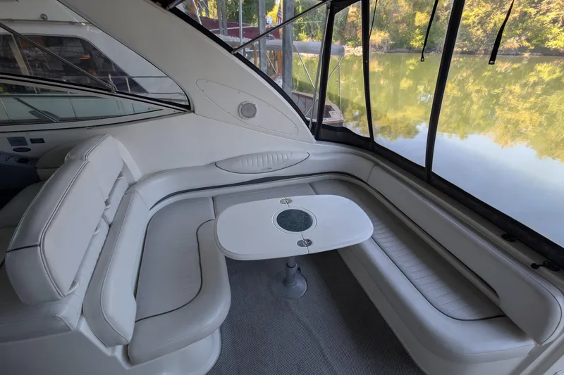 Slide: The Image of Luxurious interior of 2004 Maxum 3700 SY yacht with elegant seating and table. - 19