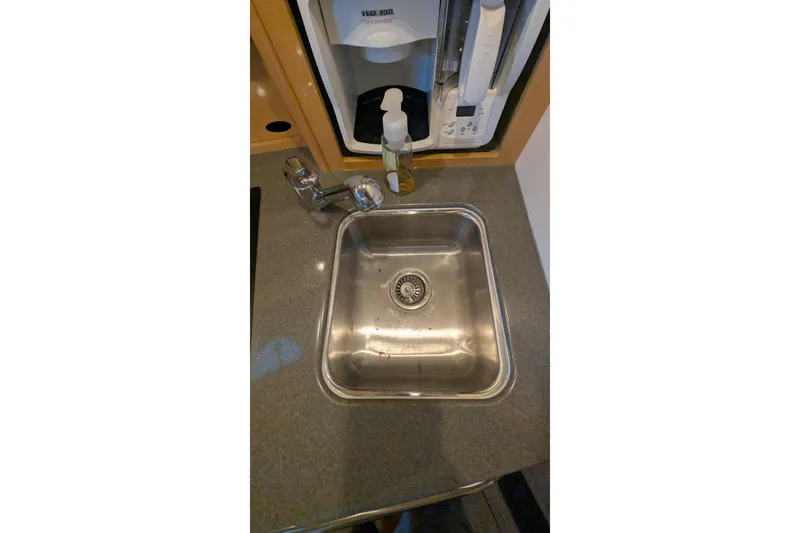 Slide: The Image of Stainless steel sink in 2004 Maxum 3700 SY yacht kitchen area. - 27