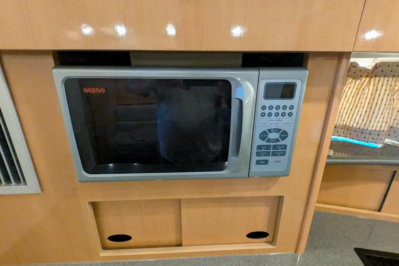 Slide: The Image of Built-in microwave in 2004 Maxum 3700 SY yacht kitchen. - 28