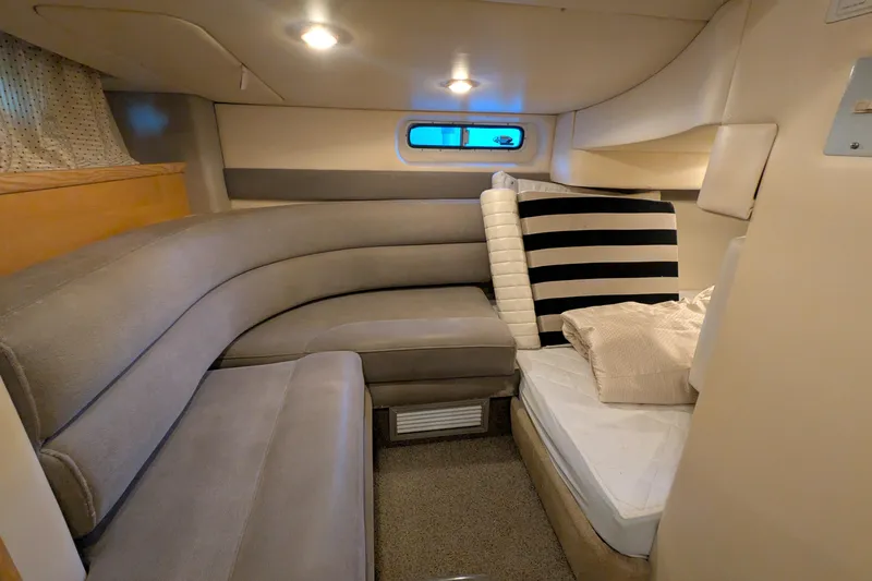 Slide: The Image of Interior of 2004 Maxum 3700 SY yacht with cozy seating and bedding. - 29