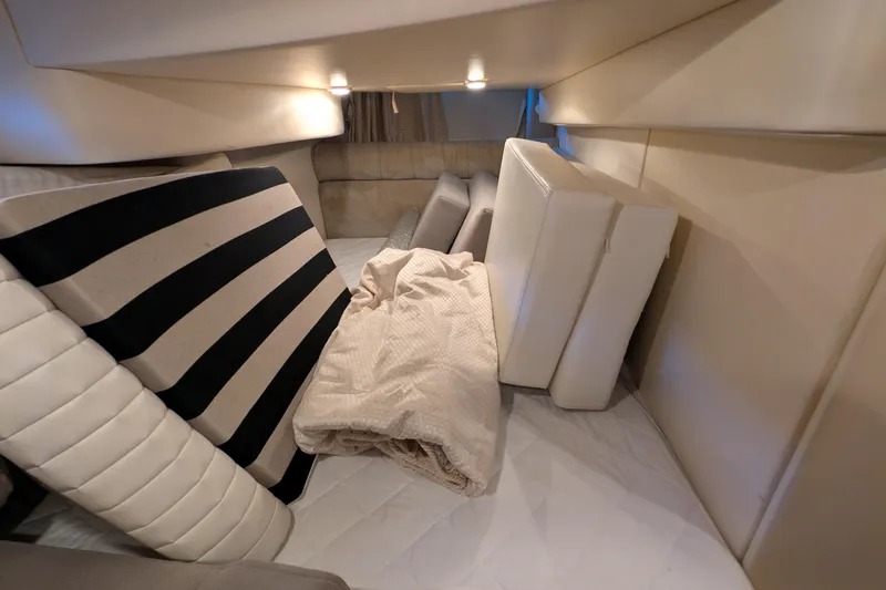 Slide: The Image of Interior cabin of 2004 Maxum 3700 SY with cushions and bedding. - 30