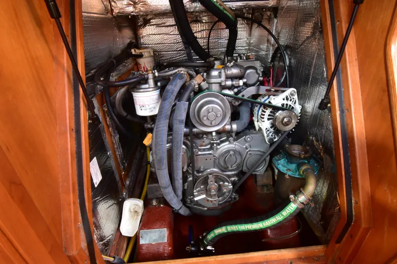 Slide: The Image of Engine compartment of a 2004 Sabre 386 sailboat, showcasing mechanical components and insulation. - 19