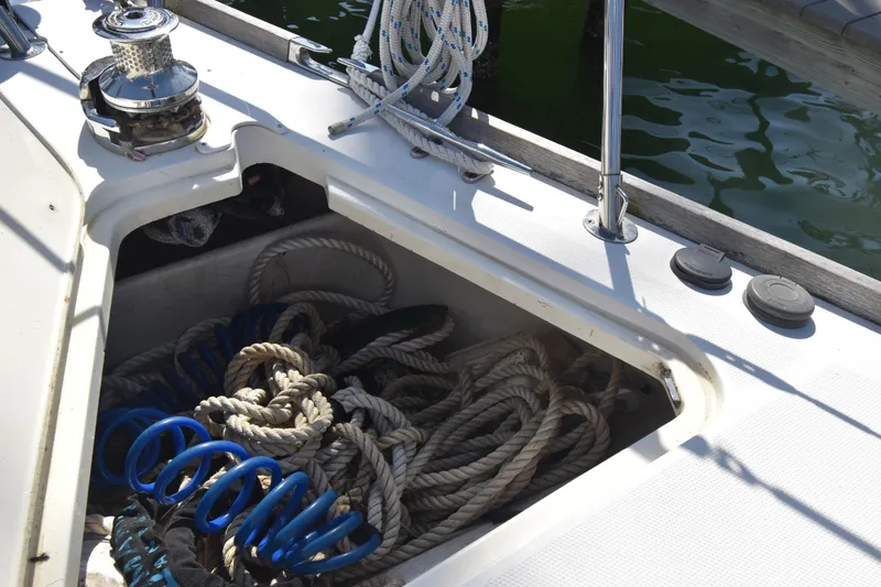 Slide: The Image of Storage compartment on 2004 Sabre 386 sailboat with ropes and winch. - 3