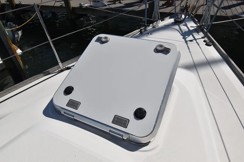 Slide: The Image of Deck hatch of a 2004 Sabre 386 sailboat, docked at a marina. - 4
