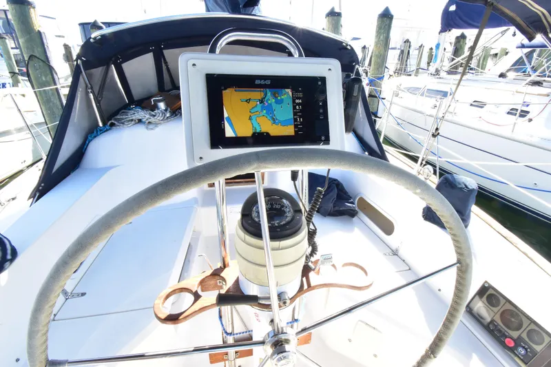 Slide: The Image of Steering wheel and navigation system on a 2004 Sabre 386 sailboat at a marina. - 6