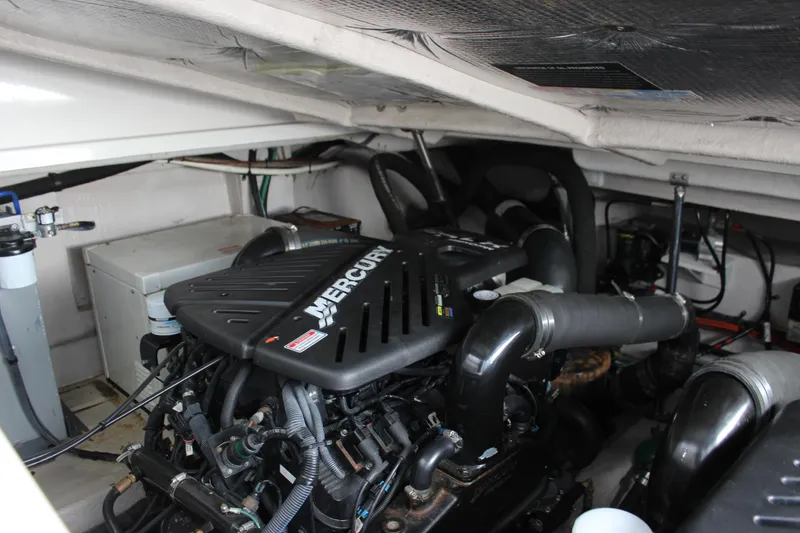 Slide: The Image of Engine room of a 2006 Sea Ray 40 Sundancer with Mercury engine components. - 16