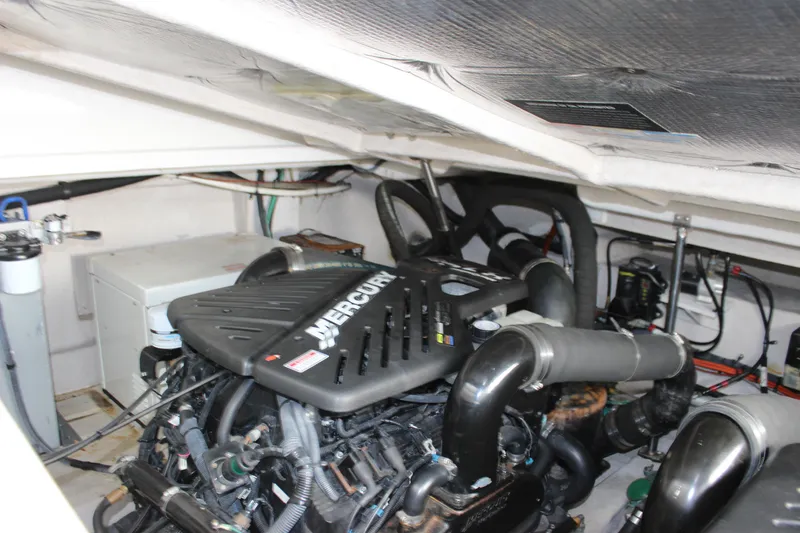 Slide: The Image of Engine room of 2006 Sea Ray 40 Sundancer with Mercury engine components. - 18