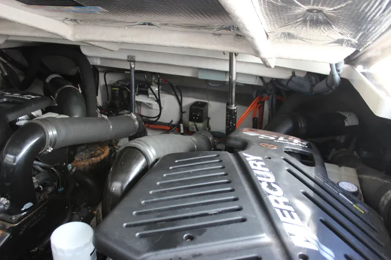 Slide: The Image of Engine compartment of a 2006 Sea Ray 40 Sundancer with Mercury components. - 19