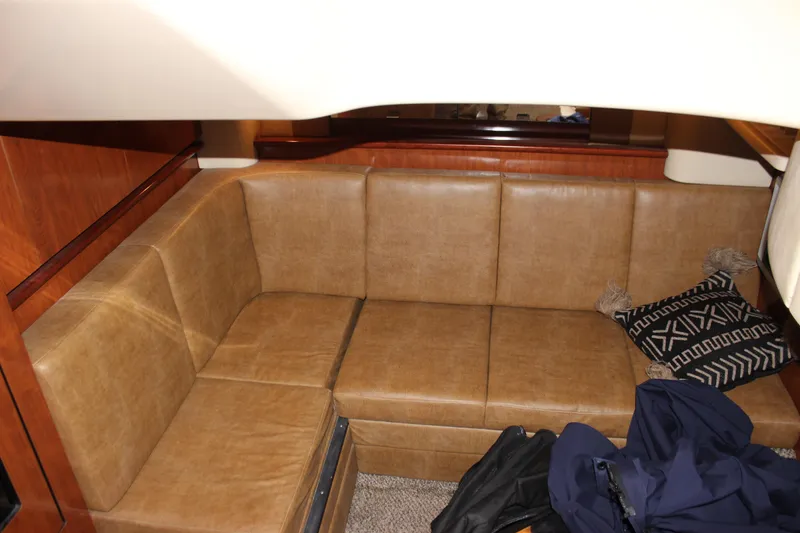 Slide: The Image of Interior of 2006 Sea Ray 40 Sundancer with tan leather seating and decorative pillows. - 22