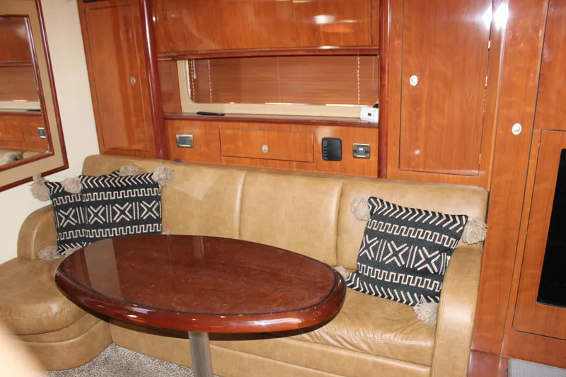 Slide: The Image of Interior of 2006 Sea Ray 40 Sundancer with leather seating and decorative pillows. - 24