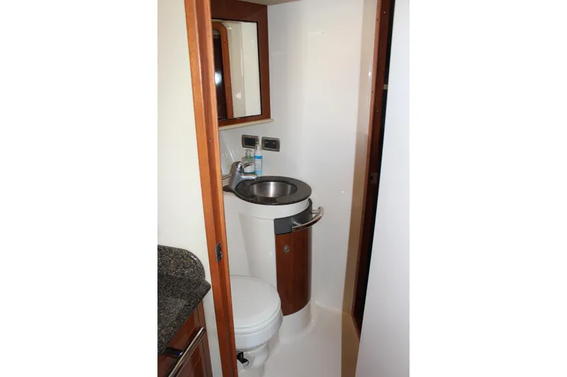 Slide: The Image of Bathroom interior of 2006 Sea Ray 40 Sundancer yacht with sink and toilet. - 29