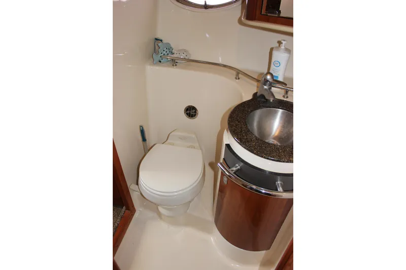 Slide: The Image of Bathroom interior of 2006 Sea Ray 40 Sundancer yacht with toilet and sink. - 31