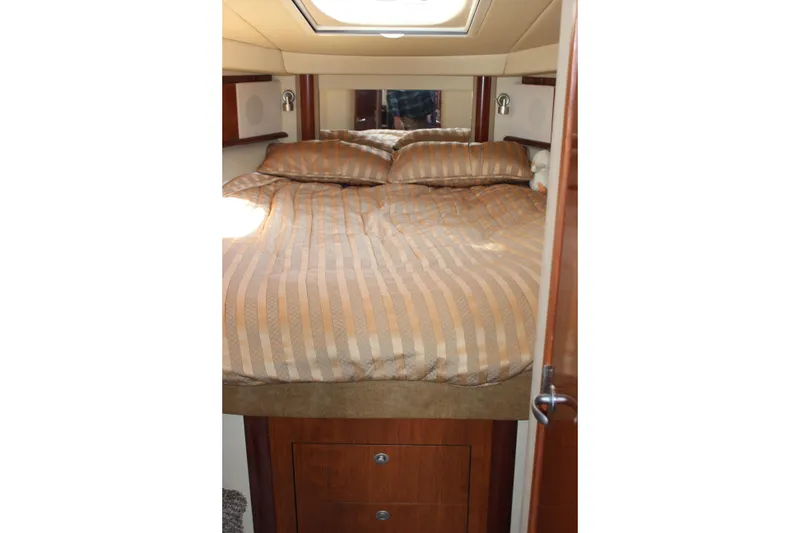 Slide: The Image of Luxurious cabin interior of 2006 Sea Ray 40 Sundancer yacht with cozy bedding. - 34