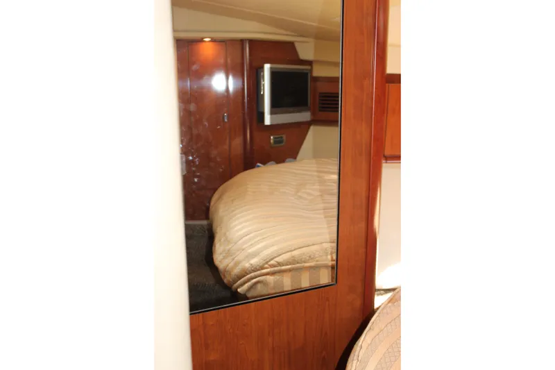 Slide: The Image of Interior cabin of 2006 Sea Ray 40 Sundancer yacht with bed and TV. - 35