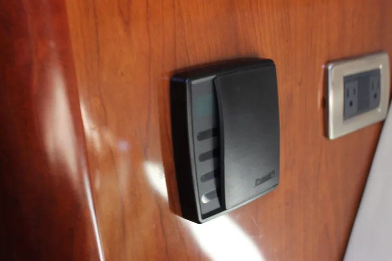 Slide: The Image of Control panel and outlet on 2006 Sea Ray 40 Sundancer wooden interior. - 39