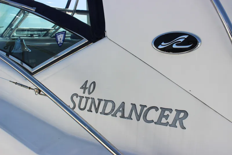 Slide: The Image of 2006 Sea Ray 40 Sundancer yacht with logo and model name visible. - 4