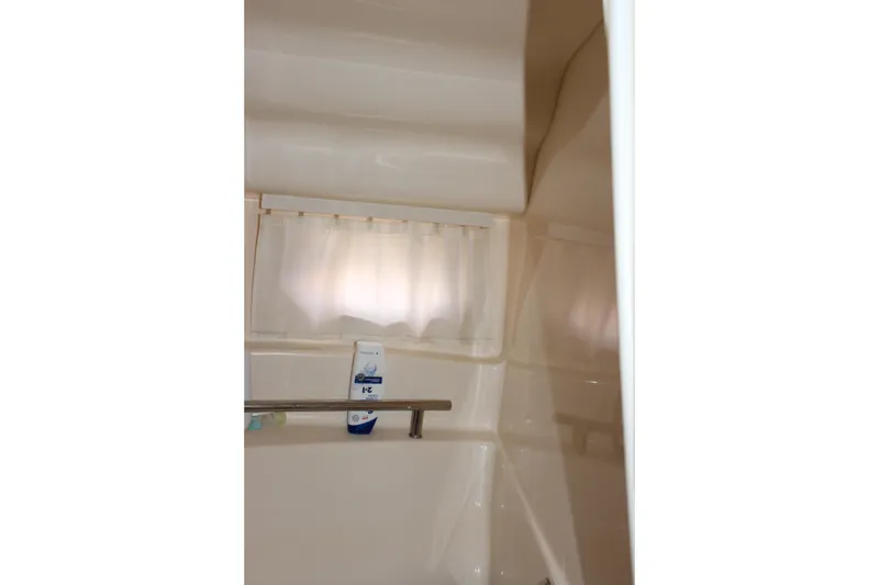 Slide: The Image of Interior of 2006 Sea Ray 40 Sundancer yacht bathroom with shower amenities. - 40