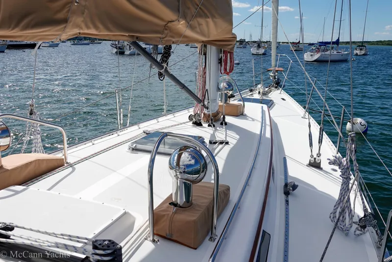 Slide: The Image of Sailboat deck view of 1993 Alden 43 Aft Cockpit, moored in a marina. - 18