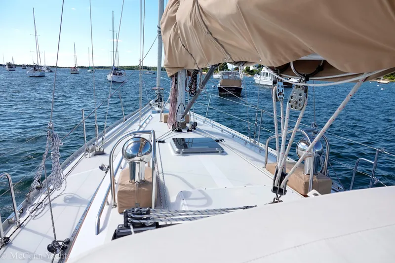 Slide: The Image of Sailing yacht Alden 43 Aft Cockpit, 1993 model, anchored in a serene harbor. - 22