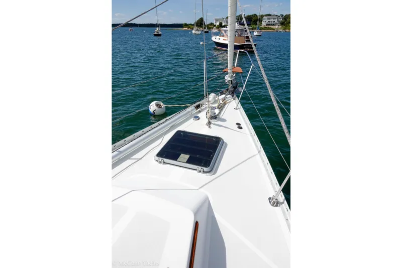 Slide: The Image of Sailing yacht Alden 43 Aft Cockpit, 1993 model, on calm waters with scenic background. - 23